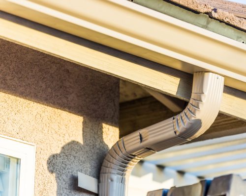 House with New Seamless Aluminum Rain Gutters.